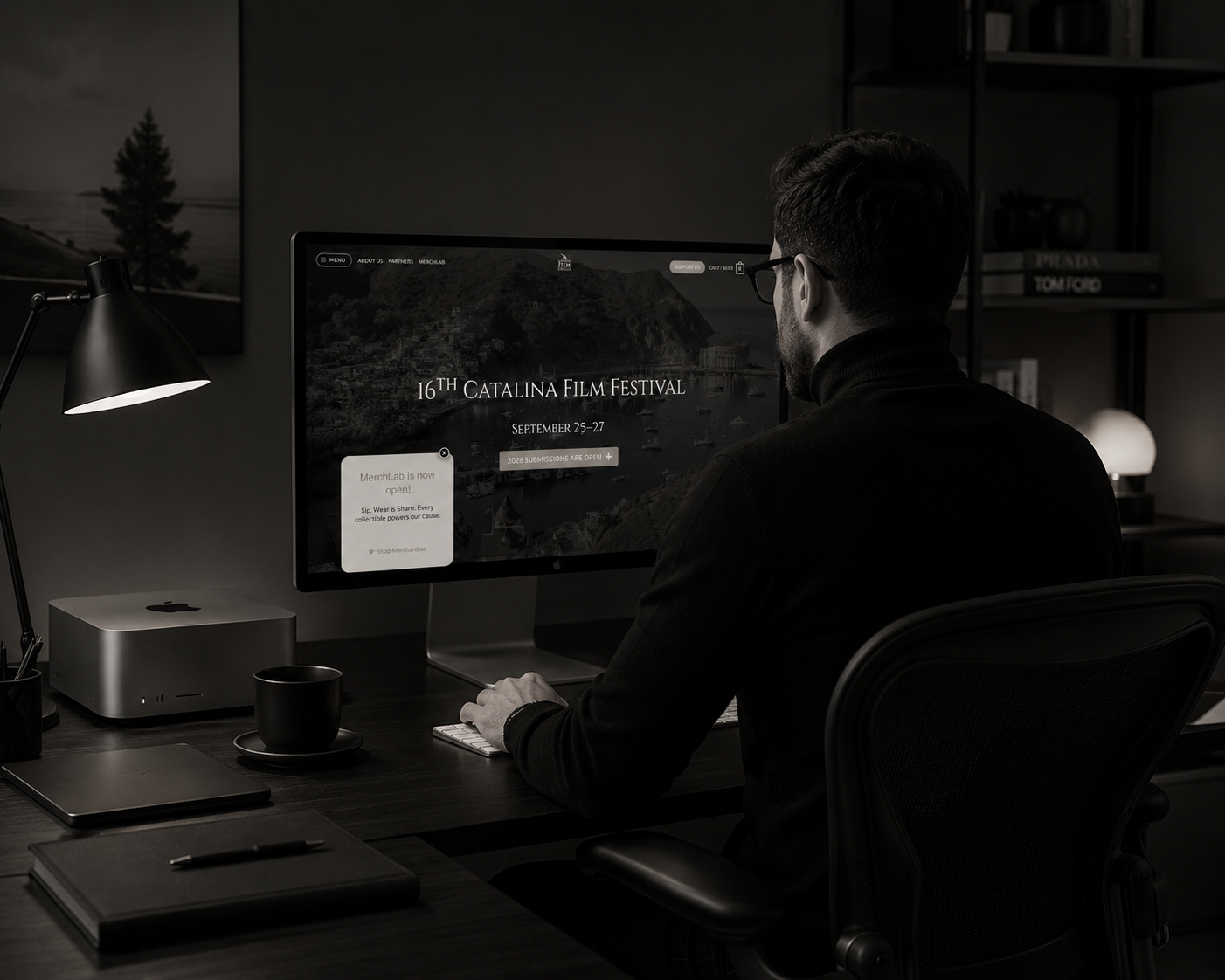 Samuele Lai working at a desk on the Catalina Film Festival website.